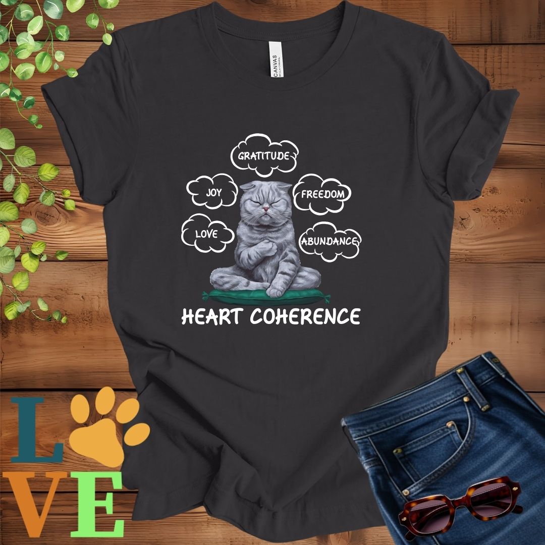 Dark grey heather t-shirt with a meditating Scottish Fold cat, surrounded by floating emotion bubbles labelled love, joy, gratitude, freedom, abundance, and 'Heart Coherence' slogan.