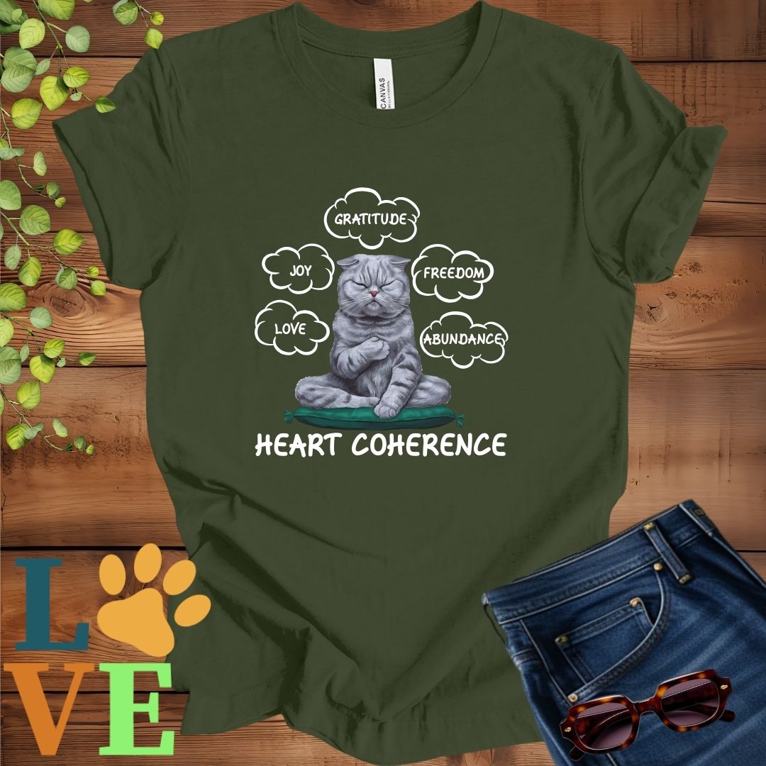 Olive green (military green) t-shirt with a meditating Scottish Fold cat, surrounded by floating emotion bubbles labelled love, joy, gratitude, freedom, abundance, and 'Heart Coherence' slogan.