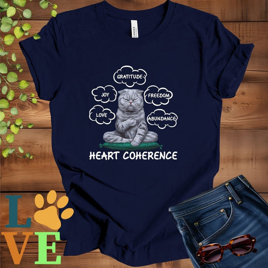 Navy Blue t-shirt with a meditating Scottish Fold cat, surrounded by floating emotion bubbles labelled love, joy, gratitude, freedom, abundance, and 'Heart Coherence' slogan.