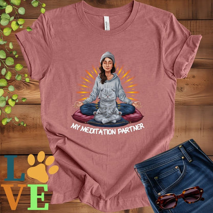 Muted mauve-purple (heather mauve) t-shirt featuring a woman meditating with her Scottish Fold cat and the slogan "My meditation partner".

