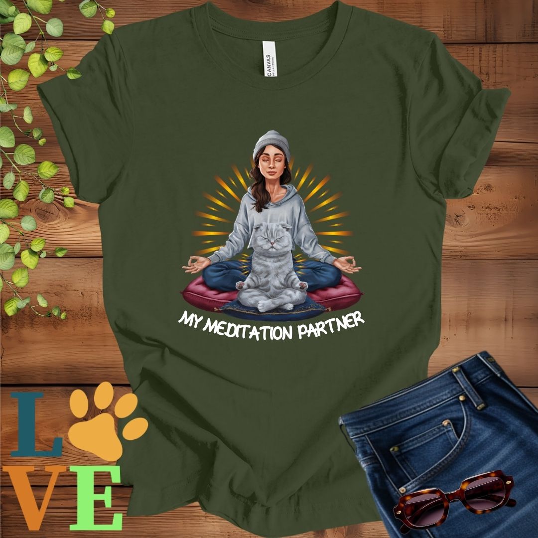 Olive green (military green) t-shirt featuring a woman meditating with her Scottish Fold cat and the slogan "My meditation partner".