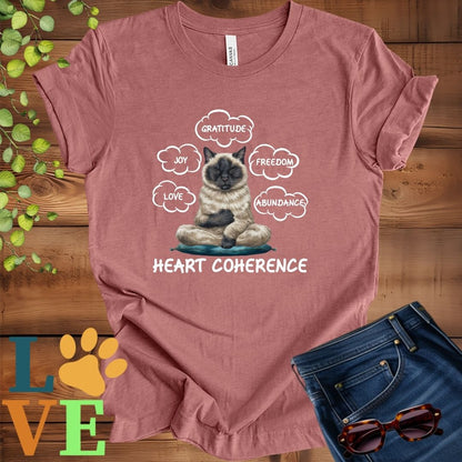Muted mauve-purple (heather mauve) t-shirt with a meditating Siamese cat, surrounded by floating emotion bubbles labelled love, joy, gratitude, freedom, abundance, and 'Heart Coherence' slogan.
