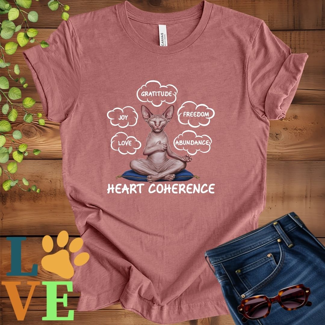 Muted mauve-purple (heather mauve) t-shirt with a meditating Sphynx cat, surrounded by floating emotion bubbles labelled love, joy, gratitude, freedom, abundance, and 'Heart Coherence' slogan.